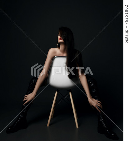 Excited naked woman in black high leather boots Excited naked woman in black high leather boots 76251862