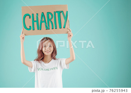 Pretty young female volunteer 76255943