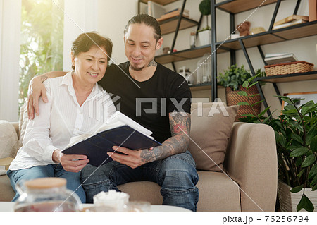 Looking at family album 76256794