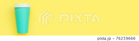 Simply flat lay design blue paper coffee cup isolated on yellow colorful background. Takeaway drink container. Good morning wake up awake concept. Template of drink mockup. Top view copy space, banner 76259666