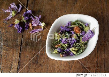 Cough herbal tea in a bowl 76260354
