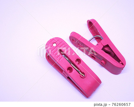 Red plastic clothespin isolated on white background Red plastic clothespin isolated on white background 76260657
