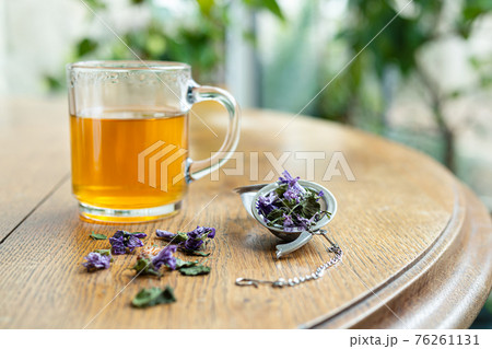 Herbal tea on an old table 76261131