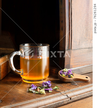 Cough herbal tea in a cup 76261294