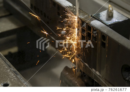 The wire EDM machine cutting the mold parts. The wire EDM machine cutting the mold parts. 76261677