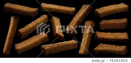 Rye bread croutons on black background, collection Rye bread croutons on black background, collection 76261903