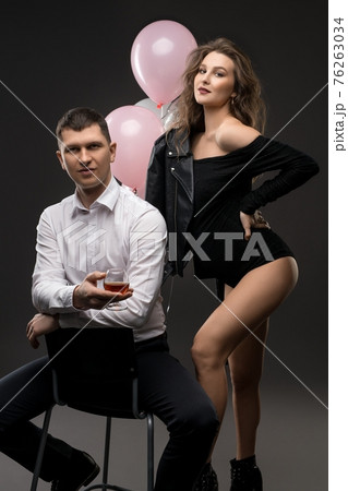 Stylish young couple expecting baby with balloons Stylish young couple expecting baby with balloons 76263034