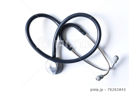 Stethoscope forming a heart on white background 76263843