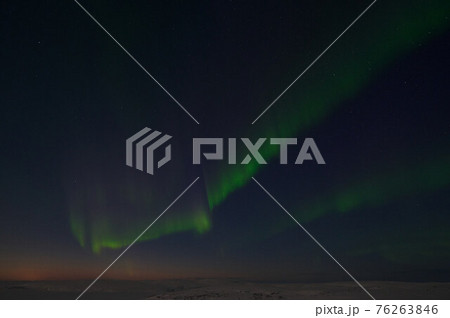 northern light on the silent field before sun rise. northern light on the silent field before sun rise. 76263846