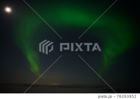 northern light on the silent field before sun rise. northern light on the silent field before sun rise. 76263852