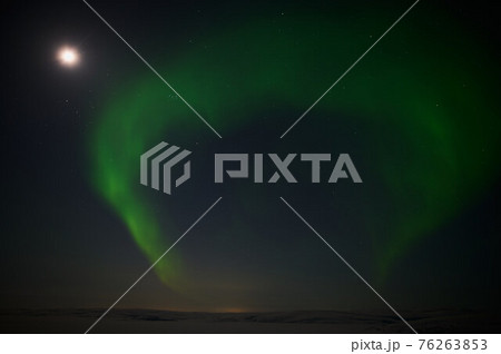 northern light on the silent field before sun rise. northern light on the silent field before sun rise. 76263853