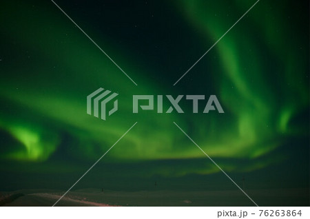 northern light on the silent field before sun rise. northern light on the silent field before sun rise. 76263864