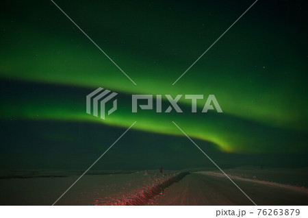 northern light on the silent field before sun rise. northern light on the silent field before sun rise. 76263879