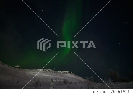 northern light on the silent field before sun rise. northern light on the silent field before sun rise. 76263911
