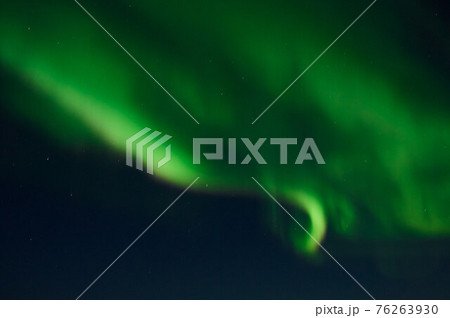 northern light on the silent field before sun rise. 76263930