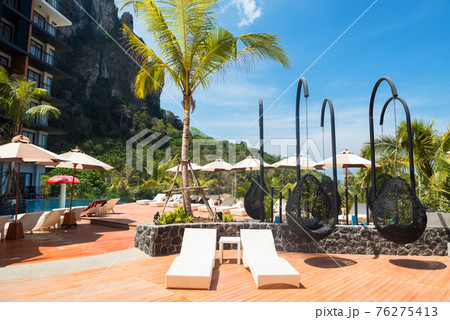 bed chair at hotel swimming pool in summer 76275413