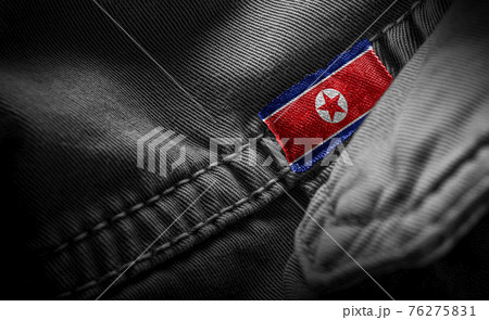 Tag on dark clothing in the form of the flag of the North Korea Tag on dark clothing in the form of the flag of the North Korea 76275831