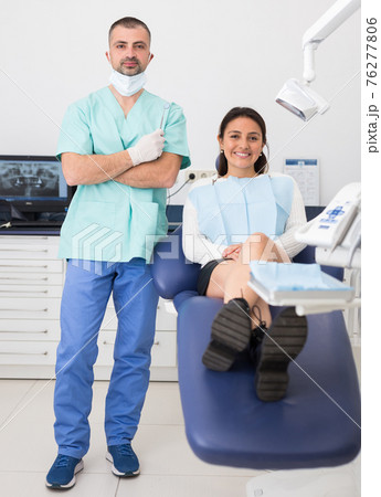 Portrait of positive dentist and happy cute woman 76277806