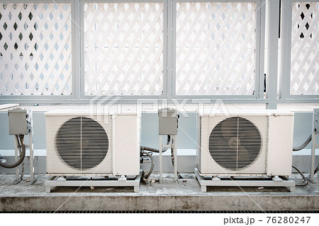 Cooling Air Condition Unit and Control System, Air Condenser Engine Station Outside Building of HVAC Systems. Electrical Compressor Fan Coil of Air Conditioning Equipment for Home Residential Units. Cooling Air Condition Unit and Control System, Air Condenser Engine Station Outside Building of HVAC Systems. Electrical Compressor Fan Coil of Air Conditioning Equipment for Home Residential Units. 76280247