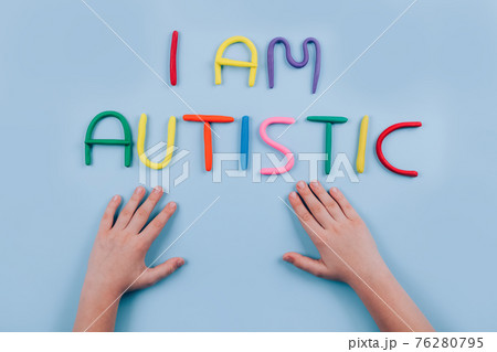 World Autism Awareness Day concept - multicolored letters, Am I Autistic - child hands playing against blue background. Autism spectrum disorder and child mental health concept. Selective focus World Autism Awareness Day concept - multicolored letters, Am I Autistic - child hands playing against blue background. Autism spectrum disorder and child mental health concept. Selective focus 76280795