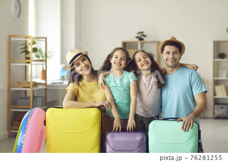 Portrait of happy smiling family with modern suitcases ready for summer vacation 76281255
