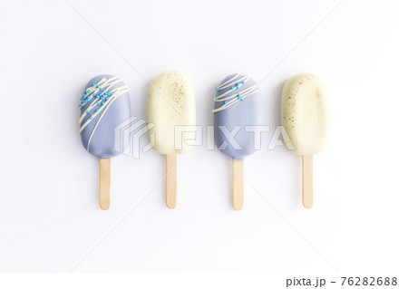 Blue and white cookie ice creams on a stick on white background 76282688