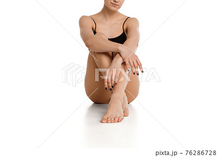 Cropped young attractive Caucasian woman isolated over white background. 76286728