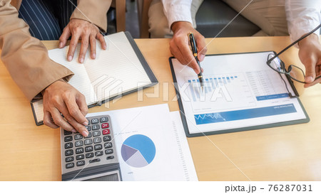 Business team brainstorming and discussing with financial data and report graph. Teamwork meeting working concept. Business team brainstorming and discussing with financial data and report graph. Teamwork meeting working concept. 76287031