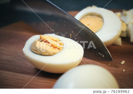 Chicken eggs on a cutting board 76289962