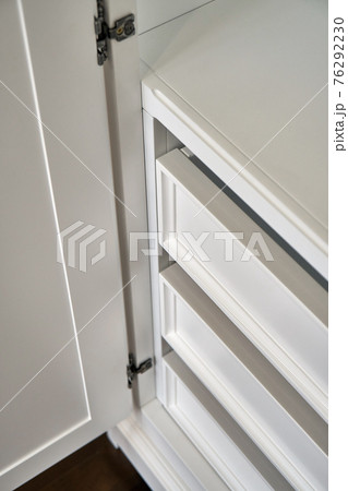 White wardrobe in classical style isolated on dark grey 76292230