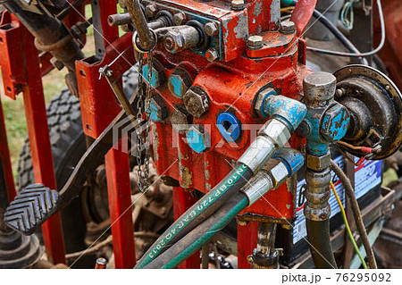 Color homemade tractor mechanism with pipes and wires Color homemade tractor mechanism with pipes and wires 76295092