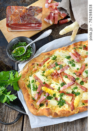 Tarte flambee from Alsace with fresh white asparagus and bacon Tarte flambee from Alsace with fresh white asparagus and bacon 76298838