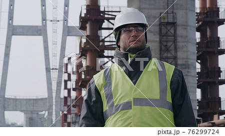 Male contractor on bridge construction site 76299724