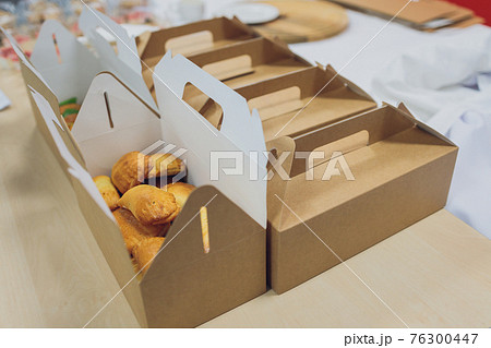 Many various take-out food containers, pizza box, coffee cups and paper bags on light grey background. Food delivery. Many various take-out food containers, pizza box, coffee cups and paper bags on light grey background. Food delivery. 76300447