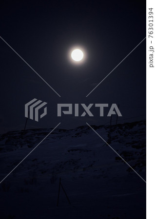 northern light on the silent field before sun rise. northern light on the silent field before sun rise. 76301394