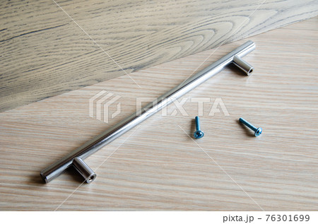 Assembling furniture, installing furniture decorative handles on the furniture facade 76301699