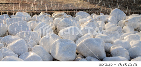 Summer beach shower in evening sunlight banner. Wall tropical rain, drops fall on floor stones. Resort scenic view Outdoor landscape. Holiday vacation background. Water on rocks spa natural clean 76302578