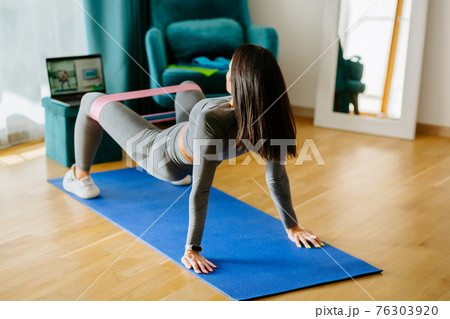Fit young Pacific Islander woman fitness training at home 76303920