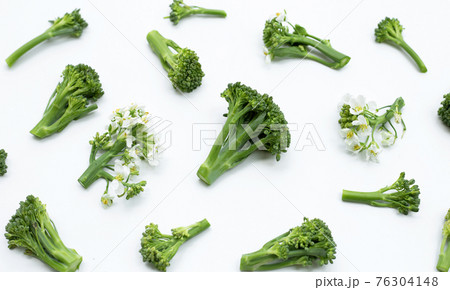 Green baby broccoli with chinese kale flower on white background. Green baby broccoli with chinese kale flower on white background. 76304148