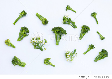Green baby broccoli with chinese kale flower on white Green baby broccoli with chinese kale flower on white 76304149
