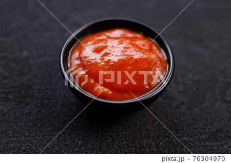 Tomato barbeque sauce dip in bowl, close up 76304970