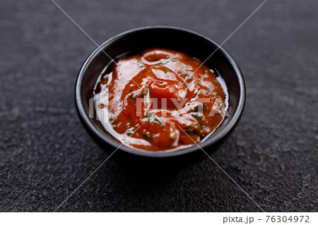 Tomato barbeque sauce dip in bowl, close up 76304972