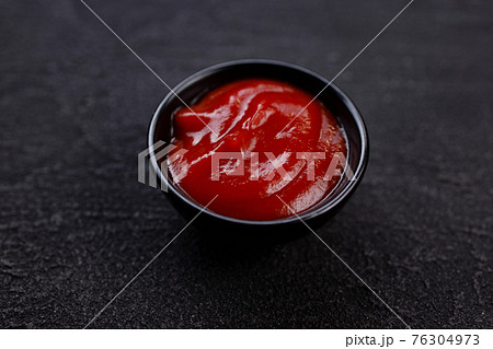Tomato barbeque sauce dip in bowl, close up 76304973