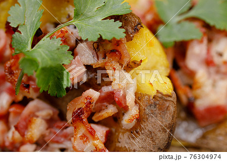 Baked whole smashed grilled potatoes with bacon 76304974