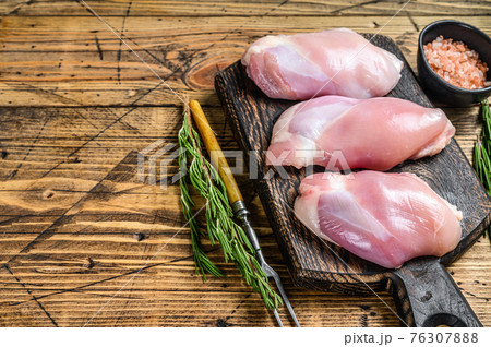 Boneless Raw Chicken thigh fillet. Wooden background. Top view. Copy space Boneless Raw Chicken thigh fillet. Wooden background. Top view. Copy space 76307888