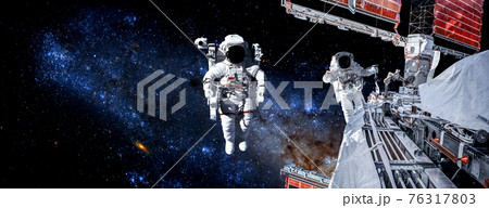Astronaut spaceman do spacewalk while working for space station 76317803