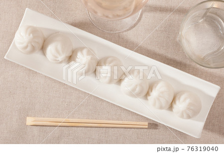 Plate of appetizing steamed dim sum Plate of appetizing steamed dim sum 76319040