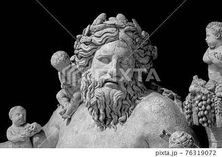 Ancient statue of Nile river god. Head and shoulders detail of the ancient art sculpture bearded man isolated on background Ancient statue of Nile river god. Head and shoulders detail of the ancient art sculpture bearded man isolated on background 76319072
