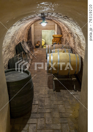 Wooden oak barrels in a winery nearby Batorove Kosihy, Slovakia Wooden oak barrels in a winery nearby Batorove Kosihy, Slovakia 76319210