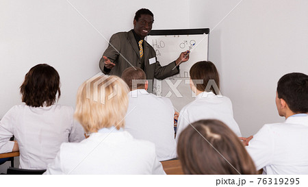 doctor lecturing to colleagues at medical conference doctor lecturing to colleagues at medical conference 76319295